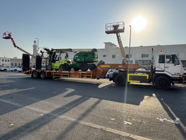 White gold General Transport 25-ton low bed trailer for heavy equipment transportation.
